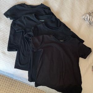 Four black tees